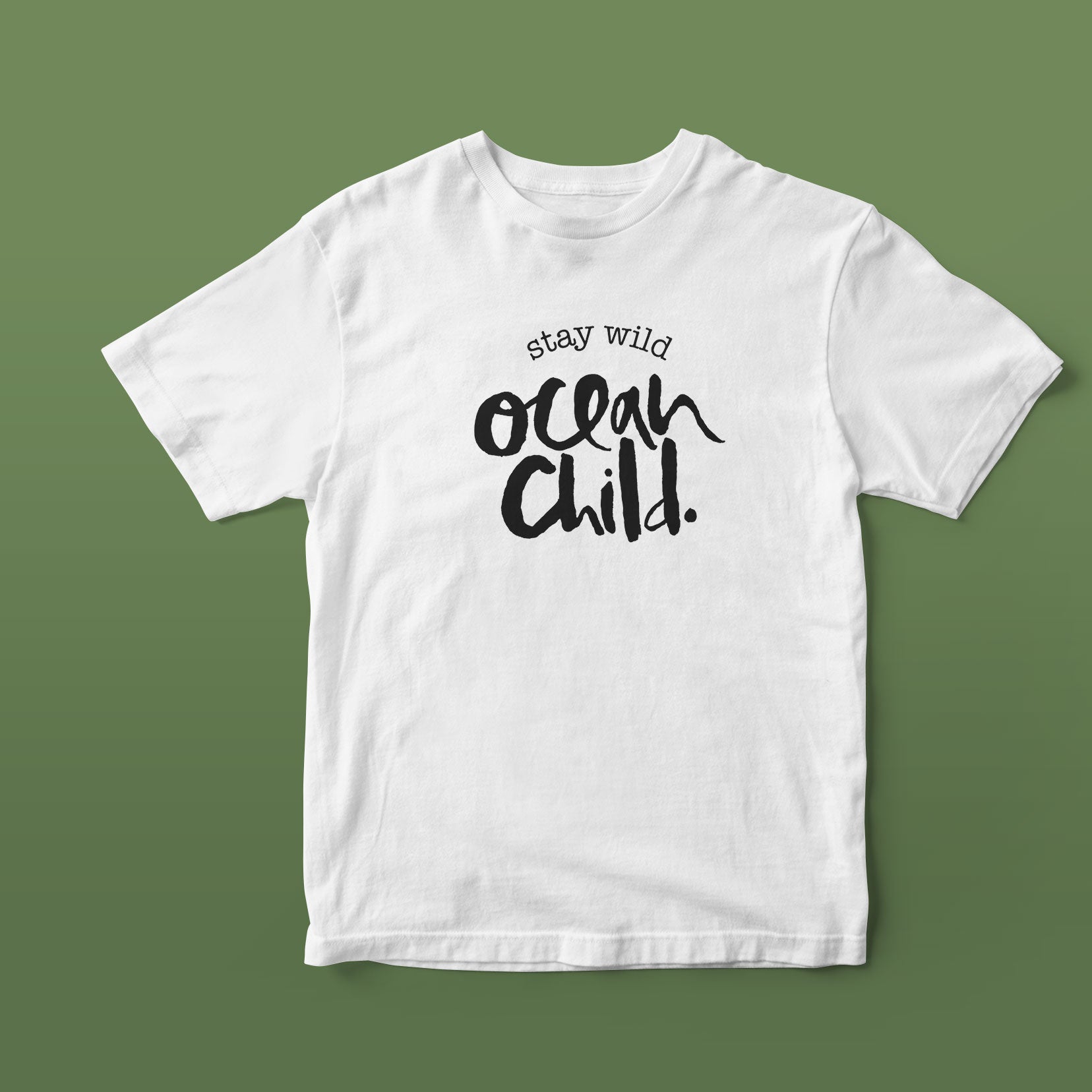 White t-shirt with 'stay wild ocean child' text on a green background